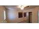 Bright bedroom with ceiling fan, closet, and windows at 4821 Whisper Lake Ave, Las Vegas, NV 89131