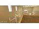 Hallway featuring neutral walls, white railing, and natural light from the windows at 4821 Whisper Lake Ave, Las Vegas, NV 89131