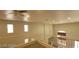 Hallway highlighting neutral walls, white railing, and natural light from the windows at 4821 Whisper Lake Ave, Las Vegas, NV 89131