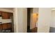 Hallway with access to laundry room with modern, updated washer and dryer at 4821 Whisper Lake Ave, Las Vegas, NV 89131