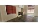 This is an empty living room with tile flooring, a fireplace and many windows for natural light at 4821 Whisper Lake Ave, Las Vegas, NV 89131