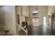 This is an empty living room with tile flooring, a fireplace and many windows for natural light at 4821 Whisper Lake Ave, Las Vegas, NV 89131