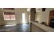 Open-concept living room with breakfast bar and natural light at 4821 Whisper Lake Ave, Las Vegas, NV 89131