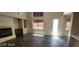 Bright living room featuring a fireplace, tile flooring, and an abundance of natural light at 4821 Whisper Lake Ave, Las Vegas, NV 89131
