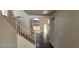 This is an empty living room with tile flooring and a staircase leading to the second floor at 4821 Whisper Lake Ave, Las Vegas, NV 89131