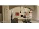 Kitchen with a view of the living room featuring a fireplace, tile flooring, and natural light at 4821 Whisper Lake Ave, Las Vegas, NV 89131