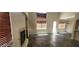 Open living area with tile floors, a fireplace, and natural light at 4821 Whisper Lake Ave, Las Vegas, NV 89131