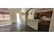 Spacious living room leading to the kitchen, with ample light from the windows at 4821 Whisper Lake Ave, Las Vegas, NV 89131