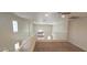 Bright second-floor loft with an open floor plan and neutral carpeting at 4821 Whisper Lake Ave, Las Vegas, NV 89131