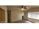 The main bedroom has a ceiling fan, carpeted floors, and natural light from the window at 4821 Whisper Lake Ave, Las Vegas, NV 89131