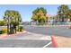 Community entrance with well-maintained landscaping and secure gate at 4843 S Torrey Pines Dr # 101, Las Vegas, NV 89103