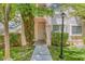 Charming condo entrance with well-maintained greenery, sidewalk, and a welcoming light fixture at 4843 S Torrey Pines Dr # 101, Las Vegas, NV 89103