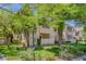 Inviting condo complex featuring lush landscaping and trees, creating a serene atmosphere at 4843 S Torrey Pines Dr # 101, Las Vegas, NV 89103