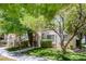 Attractive condo exterior with mature trees, manicured lawns, and a pleasant walking path at 4843 S Torrey Pines Dr # 101, Las Vegas, NV 89103