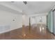 Bright living room featuring sleek wood floors and sliding glass doors to the patio at 4843 S Torrey Pines Dr # 101, Las Vegas, NV 89103