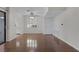 Bright living room featuring wood floors, a ceiling fan, shutters, and neutral decor at 4843 S Torrey Pines Dr # 101, Las Vegas, NV 89103