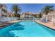 Large community pool surrounded by lush landscaping and comfortable lounge chairs at 4843 S Torrey Pines Dr # 101, Las Vegas, NV 89103
