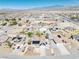 Wide aerial shot showcasing a desert neighborhood, some homes with solar panels and pools at 4910 Marywood Ct, Pahrump, NV 89061