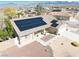Aerial view of home showcasing solar panels, desert landscaping, and a three-car garage at 4910 Marywood Ct, Pahrump, NV 89061