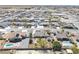 Expansive aerial view of homes in a desert community, with some featuring swimming pools at 4910 Marywood Ct, Pahrump, NV 89061