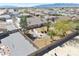 Aerial view highlighting the landscaped backyard with a fire pit and lush desert foliage at 4910 Marywood Ct, Pahrump, NV 89061