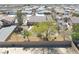 Aerial view of the spacious backyard featuring desert landscaping and mature trees at 4910 Marywood Ct, Pahrump, NV 89061
