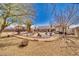 Spacious backyard showcasing well-maintained desert landscaping, a cozy patio, and ample space for relaxation and outdoor activities at 4910 Marywood Ct, Pahrump, NV 89061