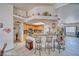Stylish kitchen with granite counters, bar seating, and open layout at 4910 Marywood Ct, Pahrump, NV 89061