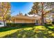 Well-maintained backyard with a lush lawn and mature trees providing ample shade at 4911 Mount Pleasant Ln, Las Vegas, NV 89113