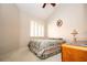 Bright bedroom featuring large window, ceiling fan, and vaulted ceiling at 4911 Mount Pleasant Ln, Las Vegas, NV 89113