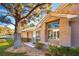 Attractive tan home exterior with mature landscaping at 4911 Mount Pleasant Ln, Las Vegas, NV 89113