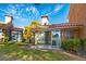 The property shows nice landscaping with large windows, sliding glass doors, and an inviting outdoor space at 4911 Mount Pleasant Ln, Las Vegas, NV 89113