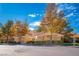 Attractive single-story home featuring mature trees and a terracotta tiled roof at 4911 Mount Pleasant Ln, Las Vegas, NV 89113