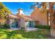 Beautiful home exterior with a well-maintained lawn, private patio, and sliding glass doors with nice architecture at 4911 Mount Pleasant Ln, Las Vegas, NV 89113