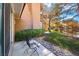 Charming exterior view highlighting the property's lush landscaping, mature trees, and pond setting at 4911 Mount Pleasant Ln, Las Vegas, NV 89113