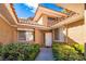 Beautifully landscaped front entrance featuring a white door, sidelight windows, and manicured shrubbery at 4911 Mount Pleasant Ln, Las Vegas, NV 89113