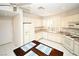 Bright, open kitchen features white cabinetry, granite countertops, and stainless appliances at 4911 Mount Pleasant Ln, Las Vegas, NV 89113