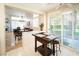 Open kitchen area with a view to the dining area, living room, shutters, and stainless appliances at 4911 Mount Pleasant Ln, Las Vegas, NV 89113