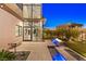 Contemporary backyard design with a sleek fire feature, water element, and well-manicured landscaping, creating a serene outdoor space at 507 Serenity Point Dr, Henderson, NV 89012