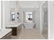 Bright bathroom features a soaking tub with scenic views, double vanity, and glass-enclosed shower at 507 Serenity Point Dr, Henderson, NV 89012