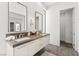 Bathroom featuring a double vanity, modern lighting, and a glimpse of a walk-in closet at 507 Serenity Point Dr, Henderson, NV 89012