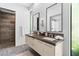 Bathroom with double vanity, tiled floor, and a sleek glass shower at 507 Serenity Point Dr, Henderson, NV 89012