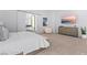 Spacious bedroom featuring a barn door leading to the bathroom, modern furniture, and ample natural light at 507 Serenity Point Dr, Henderson, NV 89012
