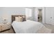 Inviting bedroom with cozy textiles and a view into an ensuite bathroom at 507 Serenity Point Dr, Henderson, NV 89012