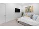 Bright bedroom with a TV, minimalist decor, and a serene ambiance at 507 Serenity Point Dr, Henderson, NV 89012