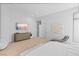 Spacious bedroom with sleek design, featuring a large TV, contemporary decor, and ample natural light at 507 Serenity Point Dr, Henderson, NV 89012