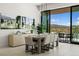 The dining room offers natural light and an access to an outdoor patio overlooking scenic views at 507 Serenity Point Dr, Henderson, NV 89012