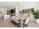Stylish dining area with modern furnishings, unique light fixtures and an open layout perfect for entertaining at 507 Serenity Point Dr, Henderson, NV 89012