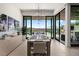 This dining room offers ample seating and a wall of sliding doors to the outdoor space, perfect for entertaining at 507 Serenity Point Dr, Henderson, NV 89012