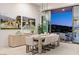 Elegant dining room with modern lighting and sliding glass doors offering stunning city views at 507 Serenity Point Dr, Henderson, NV 89012